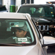 Rideshare cars wait in line in downtown San Francisco.
